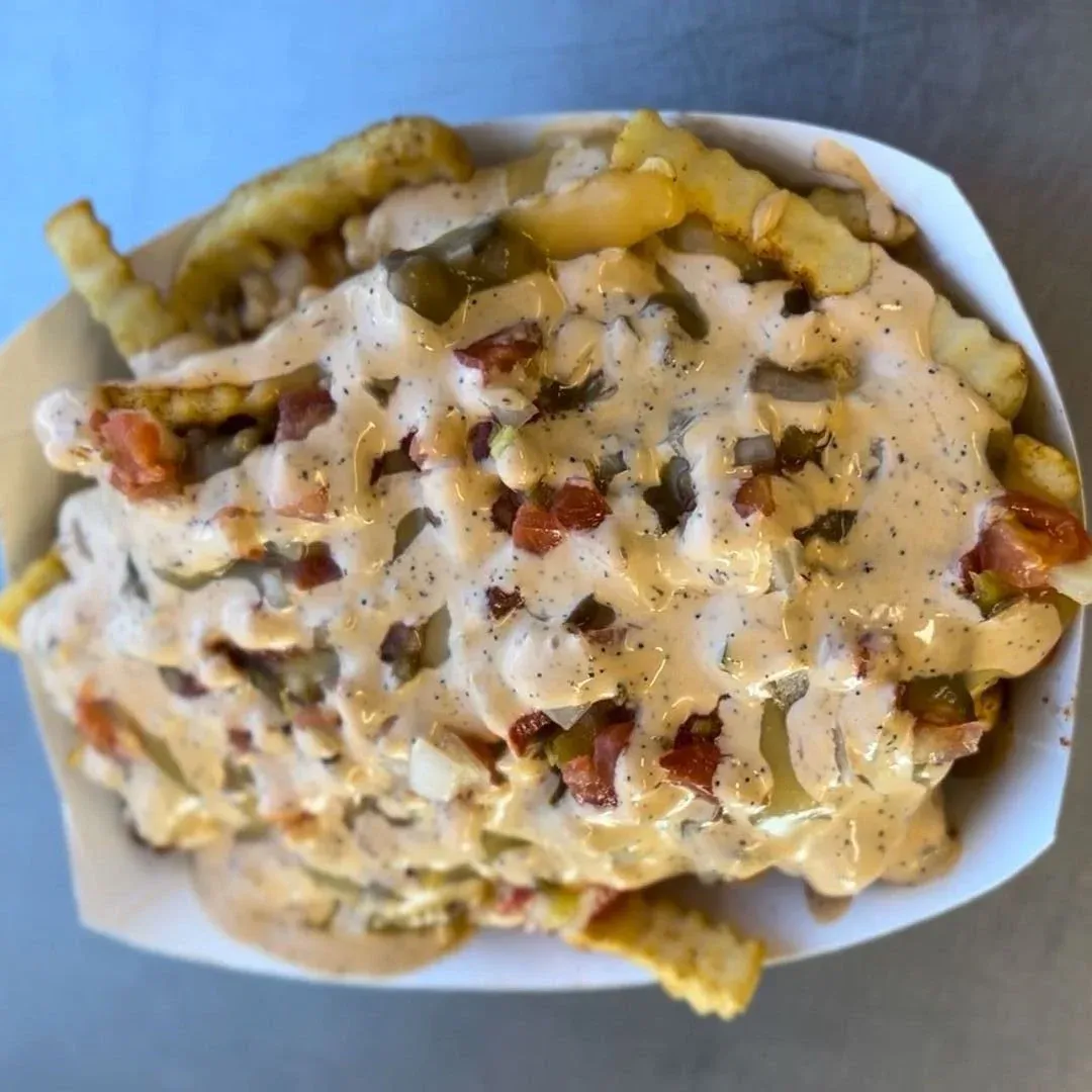 Fiesta fries loaded with chili, nacho cheese and jalapeños